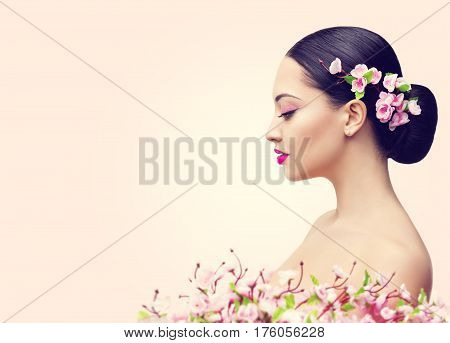 Japanese Girl and Flowers Asian Woman Beauty Makeup Profile Beautiful Fashion Model Side View over Pink Background