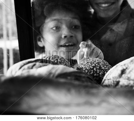 Customer Buying Fresh Baked Bread in Bakery Shop