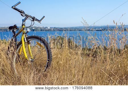 Rural View tih River and Grass and Cycle standing Outdoors