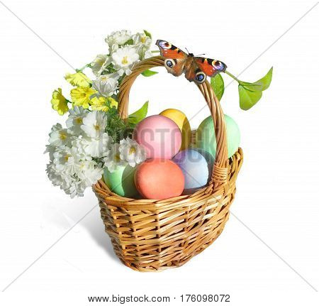 Easter basket. An orange butterfly sits on the handle of a wicker basket. The basket is full of colorful eggs and flowers. Isolated on white