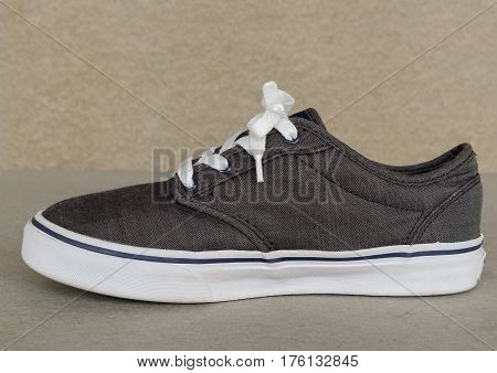close up vintage style of sport gray sneaker shoe on white gray background