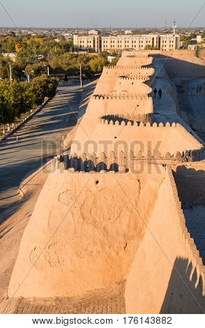 Walls with battlements of the ancient fortress of Ichan-Kala in the city of Khiva Uzbekistan