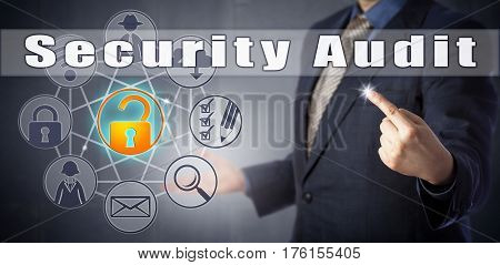 Male corporate consultant in blue shirt and suit is initiating a Security Audit. Corporate and computer security procedures metaphor and information technology concept for a technical assessment.