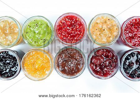 Mix of jams in jars. Homemade fruit jams