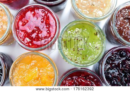 Mix of jams in jars. Homemade fruit jams