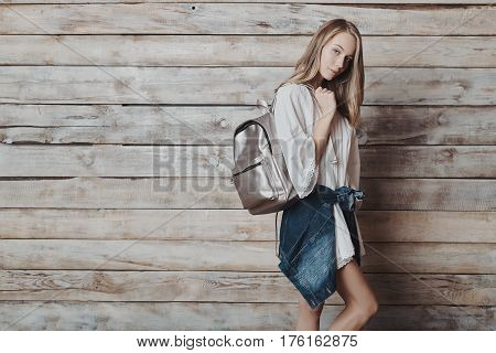 Fashion lifestyle portrait of young pretty woman in wooden room. Processed with VSCO f3 preset