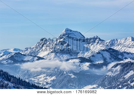 Beautiful winter landscape in the Mont Blanc Massif with the view to the Chaine des Aravis above the clouds.