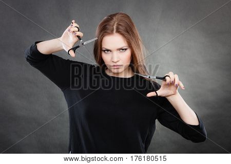 Elegance and classy. Fashion style of hairdo. Female professionalist with scissors. Elegant woman presents her hairdresser's saloon.
