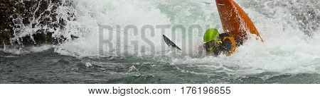 Kayaker in the waterfall in Norway Ula river