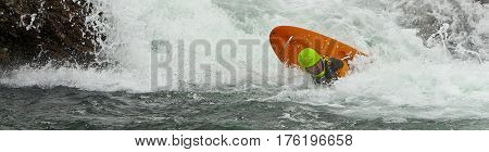 Kayaker in the waterfall in Norway Ula river