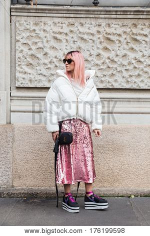 MILAN ITALY - FEBRUARY 26: Fashionable woman poses outside Ferragamo fashion show during Milan Women's Fashion Week on FEBRUARY 26 2017 in Milan.