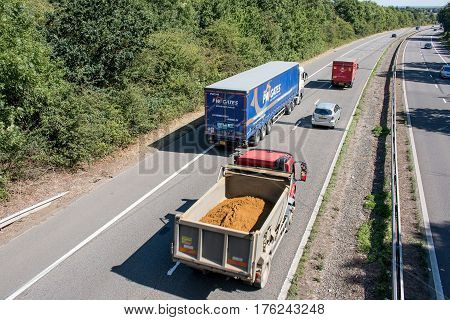Hatfield, UK - September 2016: Lorries and cars in motion on the  British motorway