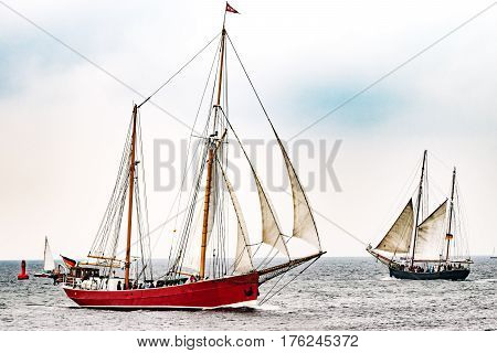 Red Sailing ship on the sea. Tall Ship.Yachting and Sailing travel. Cruises and holidays. Postcard and Book cover