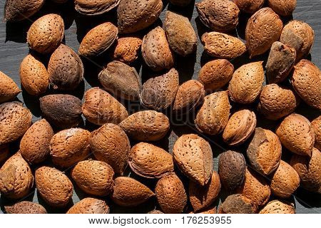 Almonds texture. Almonds background. Shelled spanish almonds. Healthy food. Close up almond background. Abstract background and texture for designers. Close up view of almonds for texture.
