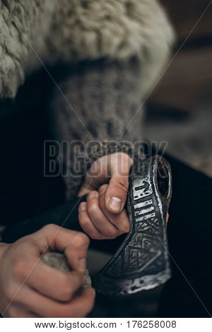 Northern Warrior With Weapon, Viking Sharpening His Axe Before Battle Hands Close-up, Scandinavian L