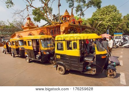 GOA, INDIA - FEB 25, 2017: Station of traditional moto rickshaw in indian city on February 25, 2017. Near 5 million tourists visit Goa annually