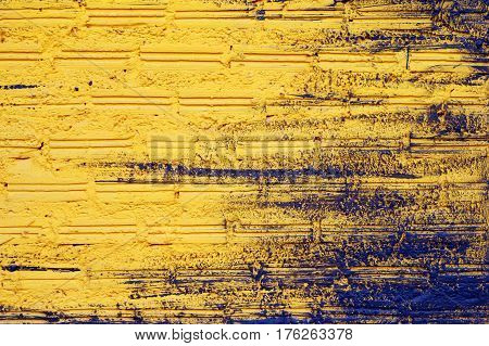 Black and yellow wall from bricks for background.