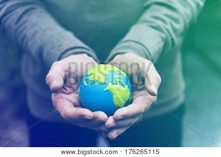 Hands holding environmental conservation globe