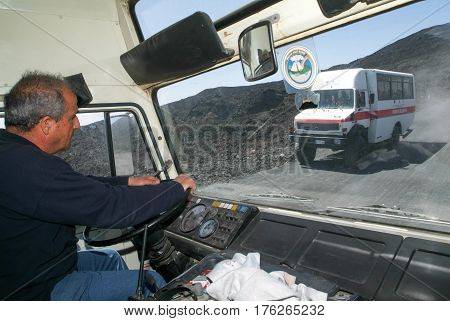 Mount Etna Italy - 15 July 2008: Driver of a tourist bus of mount Etna on Sicily Italy