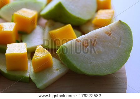 Fresh fruits - guava and mango on the white background.
