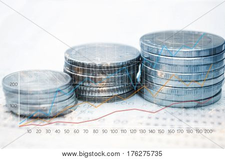 Double exposure coins with book bank and growing graph Saving money Economy Investment and Saving Concept.