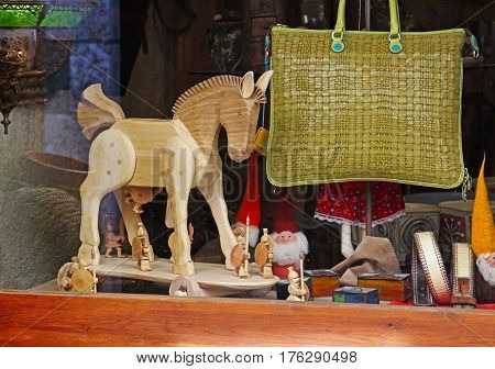 Besalu Spain - September 09 2014: Showcase with Trojan horse bag gnomes and strap in Besalu (Catalonia Spain)