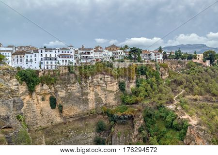 View of the buildings standing on the edge of a cliff in Rondo Spain