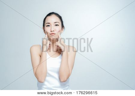Happy asian young woman beautiful smile with think gesture posture isolated on white background
