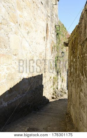 Narow stone alley in the medieval village of Tui in the province of Pontevedra Spain.