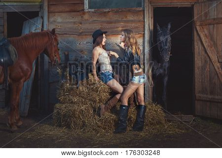 Women are on the ranch with horses. Women conflict with each other.