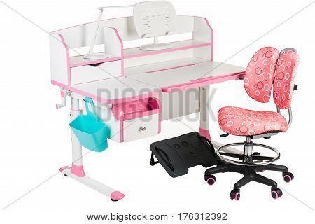 Pink chair pink school table blue basket desk lamp and black support under legs on the white isolated background.