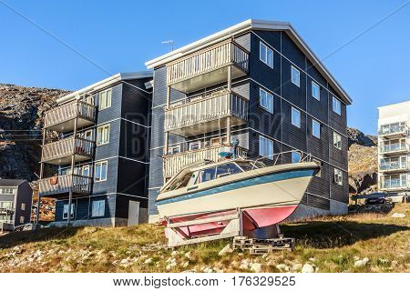 Greenlandic house with motorboat stored for a winter time Nuuk Greenland