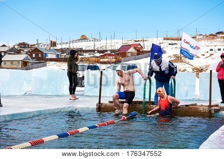 Sahyurta ,irkutsk Region, Russia - March 11.2017: Cup Of Baikal. Winter Swimming. Butterfly. Man And