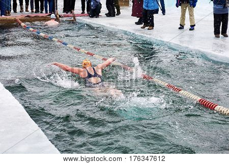 Sahyurta ,irkutsk Region, Russia - March 11.2017: Cup Of Baikal. Winter Swimming. Butterfly. Woman