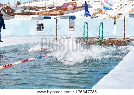 Sahyurta ,irkutsk Region, Russia - March 11.2017: Cup Of Baikal. Winter Swimming. Butterfly