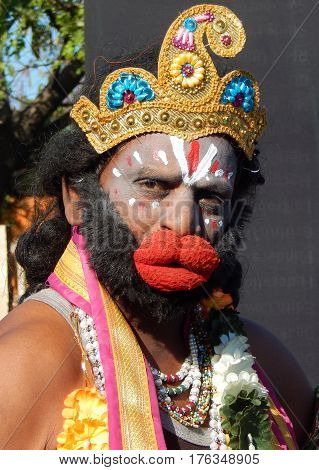 HYDERABAD,INDIA-FEBRUARY 19:Portrait of Indian man with makeup of Hindu deity Hanuman,monkey god entertain people on February 19,2017 in Hyderabad,India.