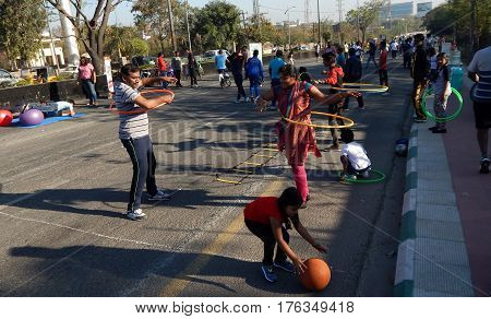 Hyderabad,india-february 19:people Play With Hula Hoop On Sunday In Open Road As Physical Literacy D