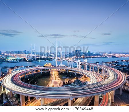 shanghai nanpu bridge in nightfall busy traffic background