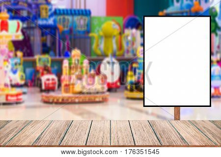 Billboard for store front Advertising poster sign and blurred amusement park in the shopping mall as background for montage display Mock up for display of product.