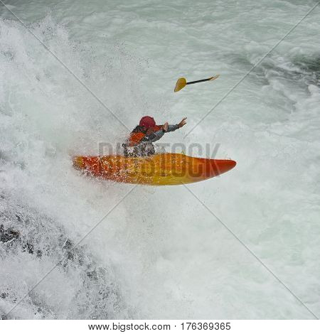 Kayaker in the waterfall in Norway Ula river