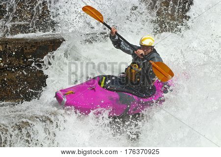 Kayaker in the waterfall in Norway Ula river