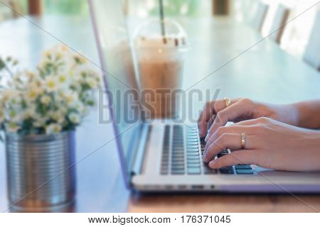 Woman Hands Typing On Laptop stock photo