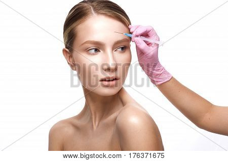 Young girl with a healthy skin and Nude makeup. Beautiful model on cosmetic procedures botox. Injections of beauty and youth. The beauty of the face