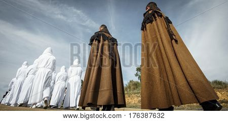 Wide angle of easter traditional procession people in bercianos de aliste brotherhood, zamora, Spain. Rear view