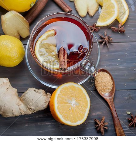 Cup Of Ginger Tea With Lemon And Honey On Dark Brown Wooden  Background