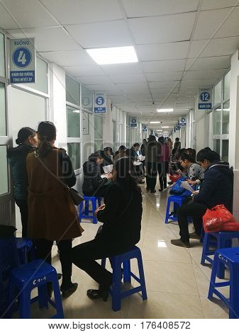 Hanoi, Vietnam - Sep 27, 2016: Asian patients waiting for their turns to be examined at 108 Military Central Hospital, also known in many variations as Army Medical Institute 108.