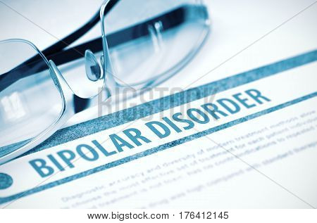 Bipolar Disorder - Medicine Concept with Blurred Text and Glasses on Blue Background. Selective Focus. 3D Rendering.