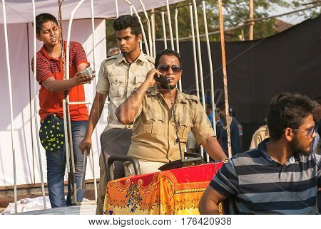 PANJIM, INDIA - FEB 25, 2017: Scene with actors in policemen uniform playing corruption police department at traditional Goa carnival on February 25, 2017. Carnaval is celebrated in Goa since 18th century