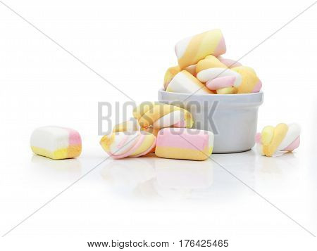 Pastel Marshmallows in white cup on white background