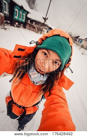 Winter Sport Activity. Woman Hiker Hiking With Backpack And Snowshoes Snowshoeing On Snow Trail Fore